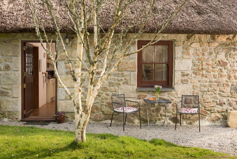 High ceilings and exposed beams are the key features of this pretty barn conversion in Cornwall.