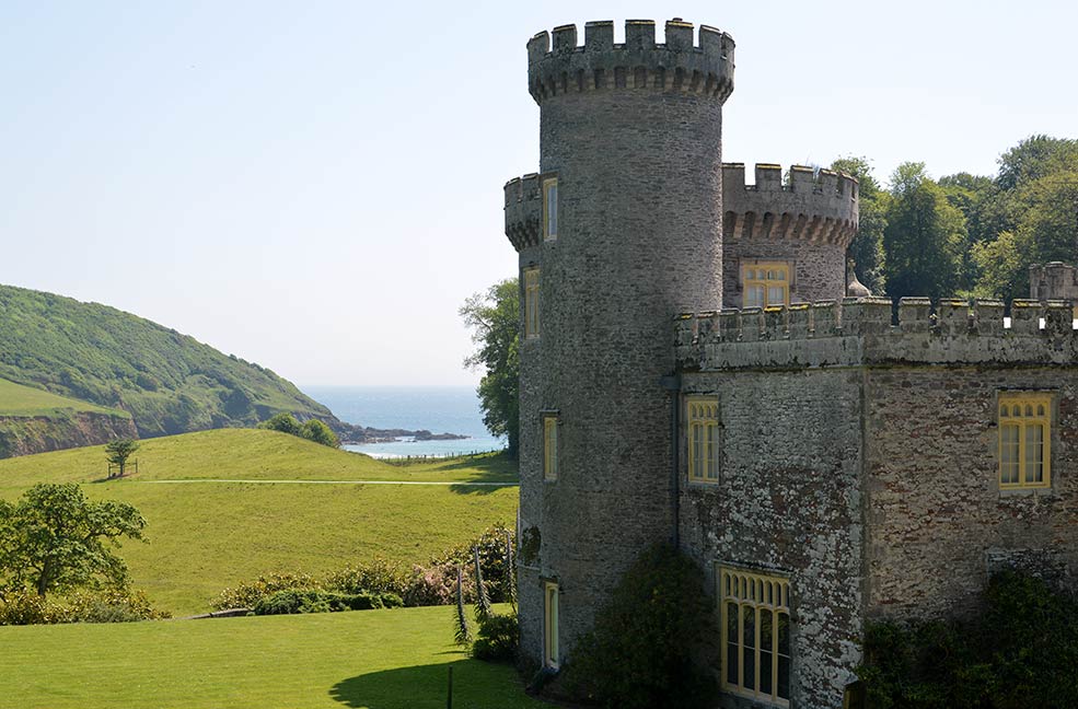 A view of Porthluney beach from the front of Caerhays castle.