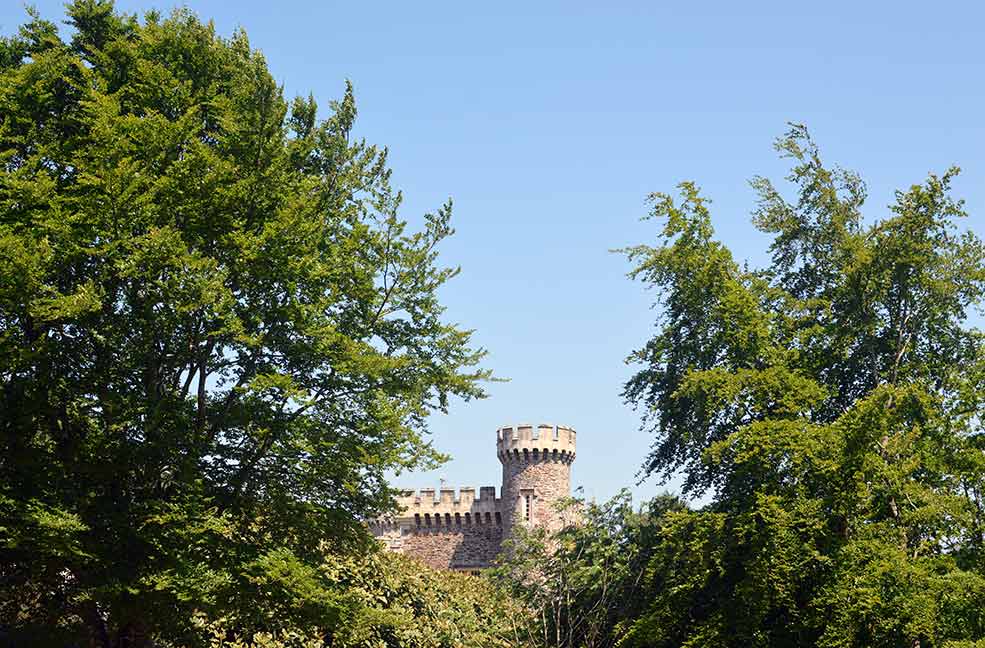 The castle turret peeking out over the trees greets you as you head into the gardens.