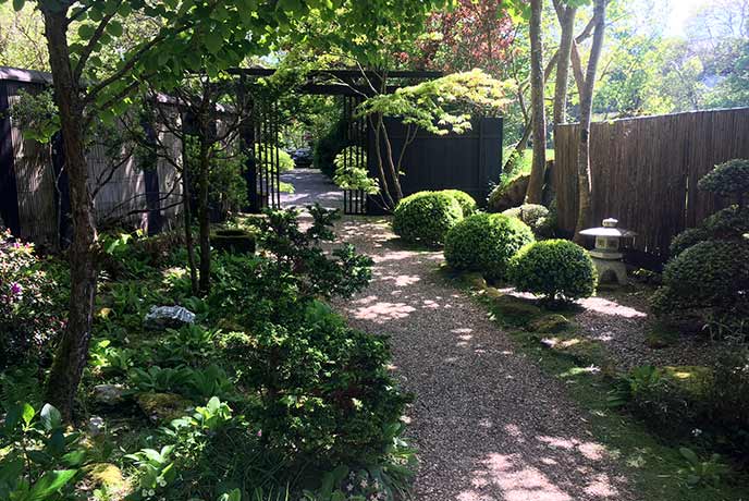 Follow the neat gravel paths through the garden as you relax in the sunshine and the scent of the blooming flowers.