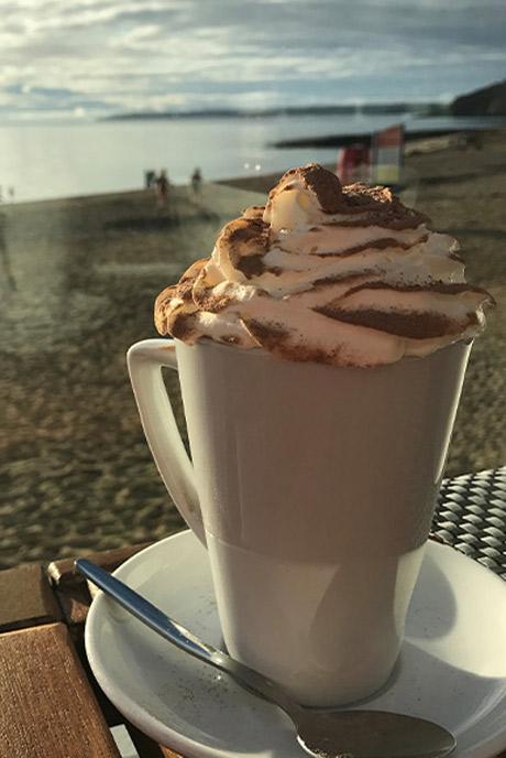 Hot chocolates by the beach at Gylly Beach Cafe in Cornwall
