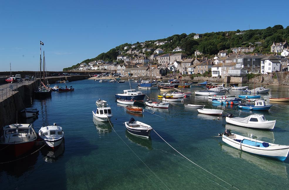 Mousehole harbour is beautiful at all times of the year. Visit in December and January to see the Christmas lights glow over the water.