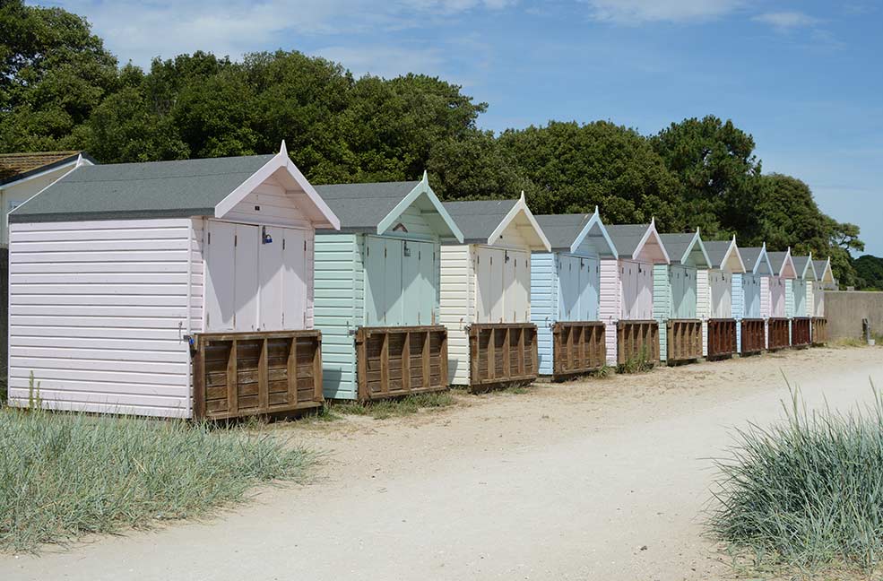 The pastel coloured beach huts on Avon beach mean summer is finally here.