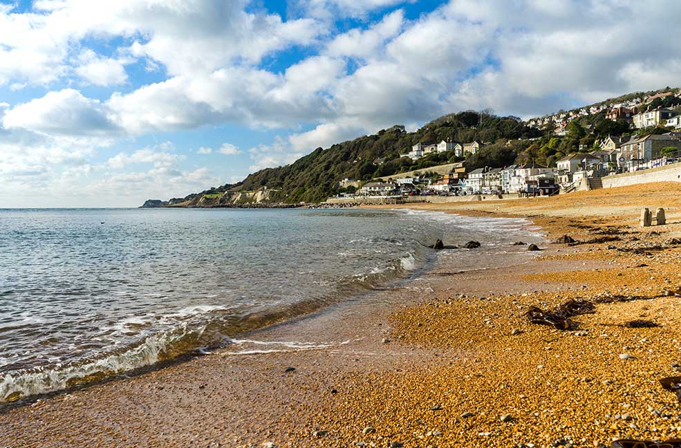 Ventnor Haven remains sheltered by the cliffs all year round, perfect for a relaxing beach walk.