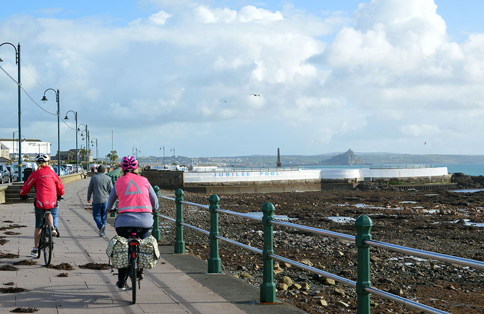 Cycle along the promenade at Penzance before taking a dip in Jubilee Pool.