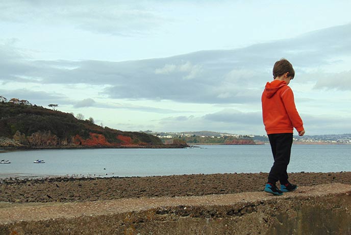 Bring kids along for a walk by the sea.