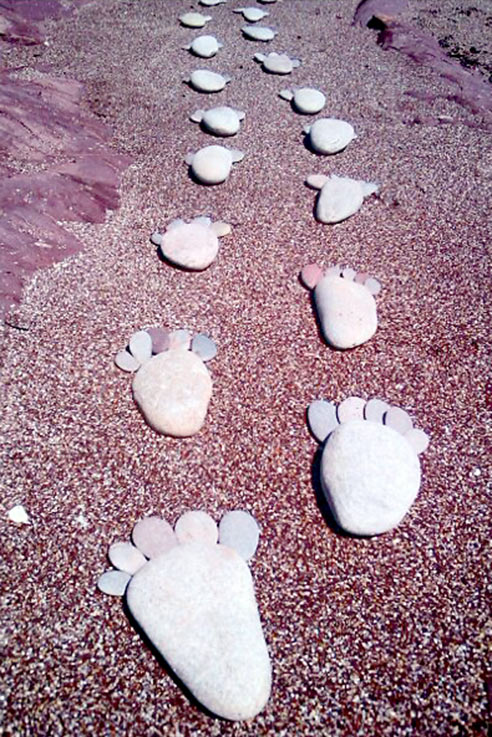 Pebble footstep beach art