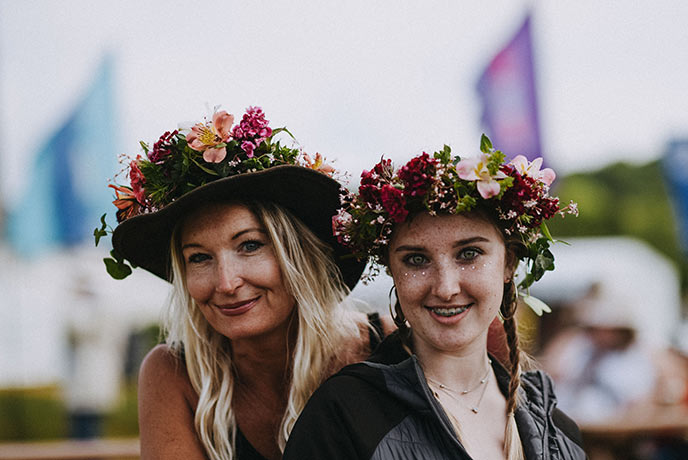 Two guests getting into the festival spirit at the River Cottage Food Fair.