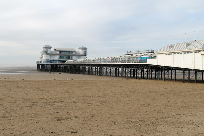 The Grand Pier looms over the beach, home to plenty of amusements and arcades.