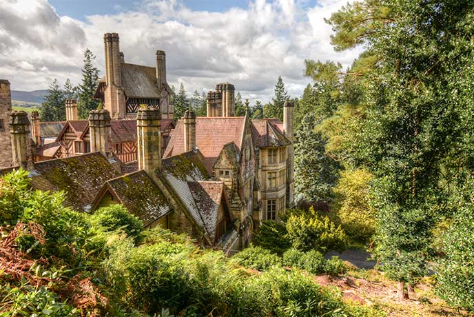 The beautiful historic house at Cragside nestled in the trees