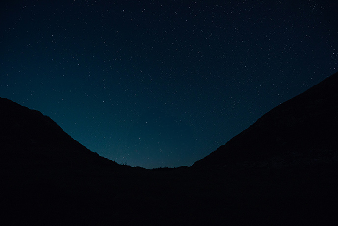 The famous Sycamore Gap in Northumberland at night with a sky full of stars