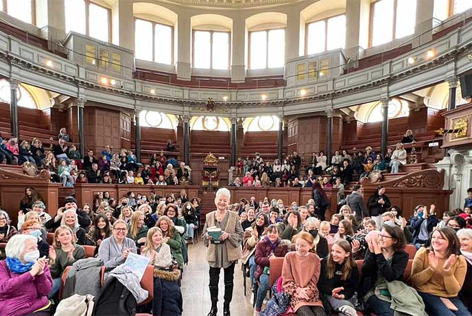 Dame Jacqueline Wilson standing amongst the crowd at her talk at the Oxford Literary Festival