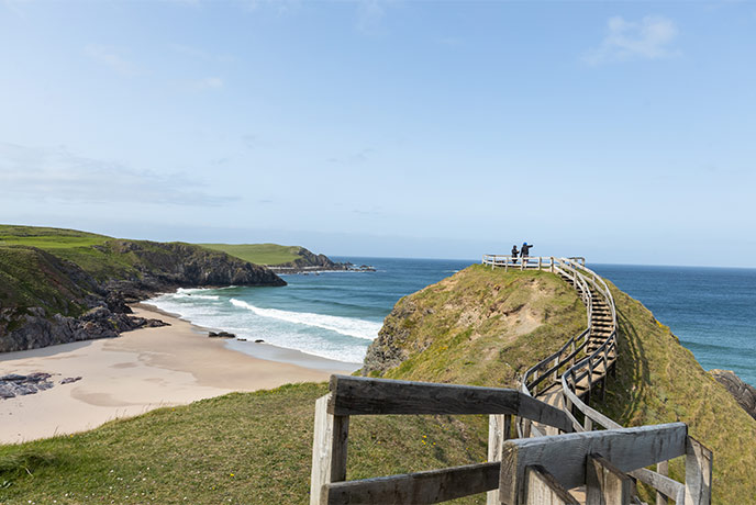The steps leading up to the Sango Bay viewpoint in Durness with the sand and sea beyond