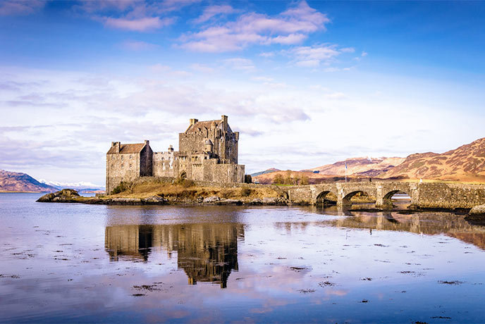 The beautiful Eilean Donan Castle reflected in the water of the lochs