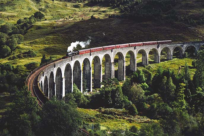 The famous steam train on the Glenfinnan Viaduct in the Scottish Highlands