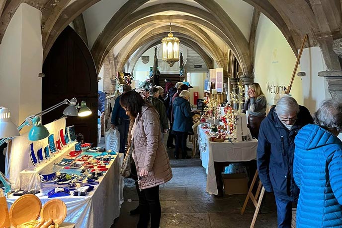 The Christmas Artisan Market at The Bishop's Palace in one of the incredible hallways
