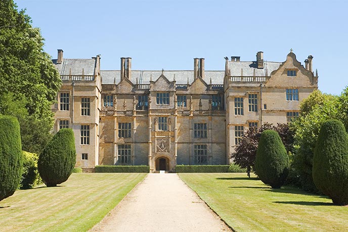 Looking down the manicured drive towards the historic Montacute House in Somerset