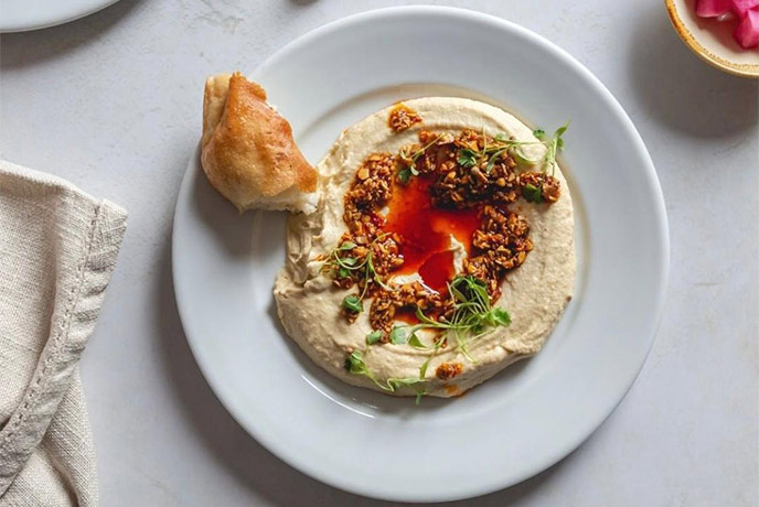 A plate of hummus at Queen of Cups in Somerset