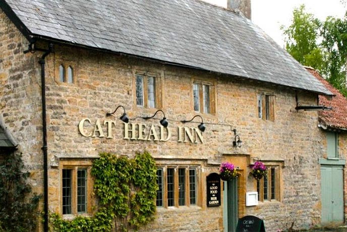The golden bricked exterior of the Cat Head Inn in Somerset