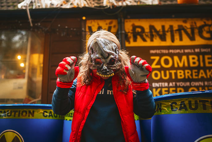 A child wearing a Halloween mask at Mendip Activity Centre in Somerset