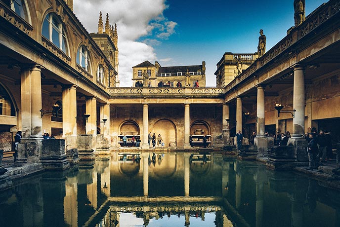 The beautiful and ancient Roman Baths, with stone pillars and incredible carvings