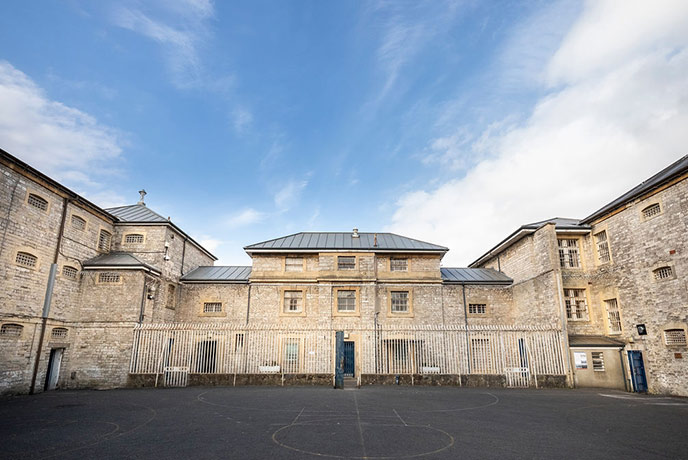 Looking across the yard at the stone building at Shepton Mallet Prison