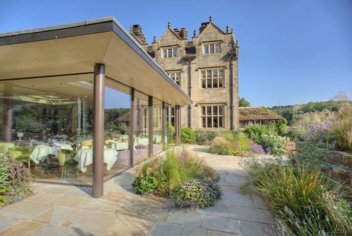 The beautiful glass-clad restaurant at Gravetye Manor in Sussex