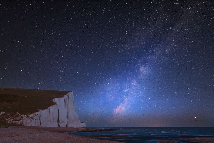 Seven Sisters cliffs with stars above