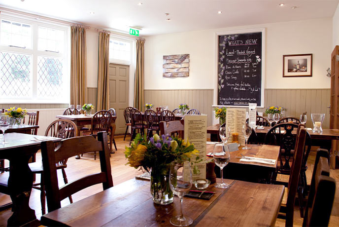 The cosy dining room at Michelin recommended The Cat Inn in West Sussex