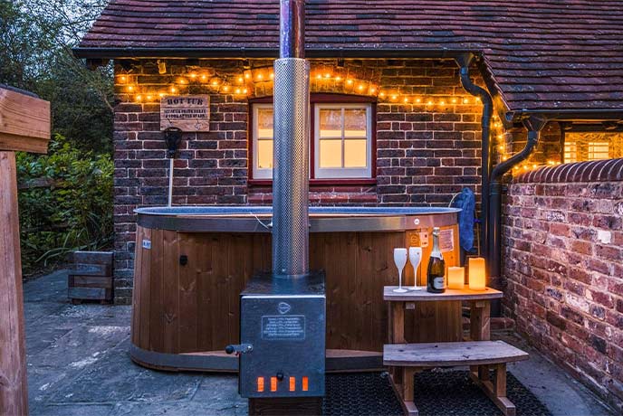 Fairy lights decorate the hot tub at The Piggery at John Bulls House in Sussex