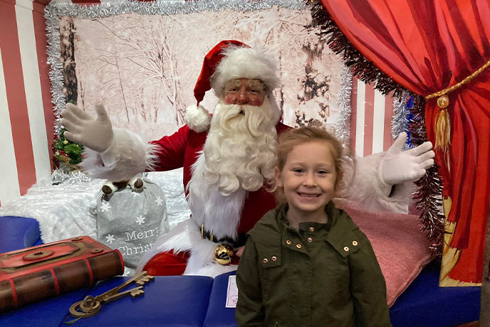 A child meeting Santa at Bluebell Railway