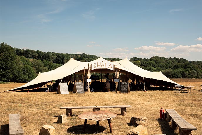 A marquee in the middle of a field at Good Vibrations Society festival in Sussex
