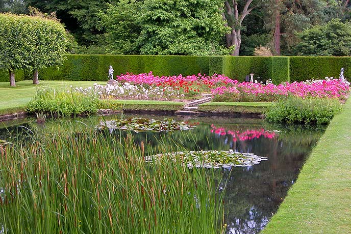 The beautiful rose garden at Bateman's, complete with delicate water feature and pond