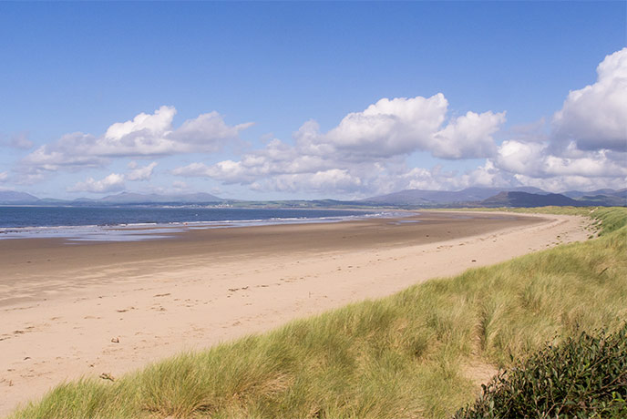The reaching golden sands at Harlech beach in Wales
