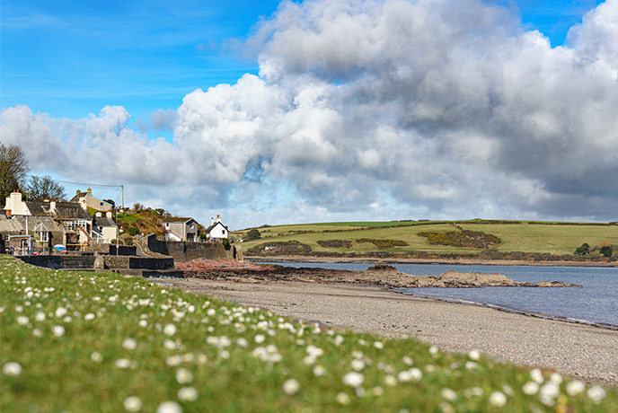 Looking down the beach at the pretty village of Dale