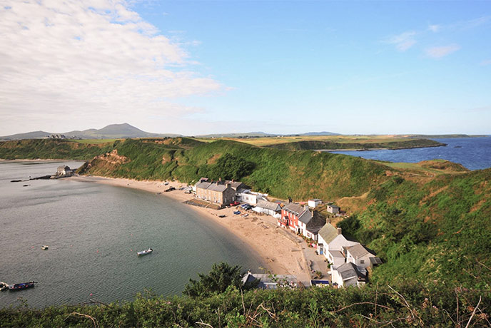 The pretty village of Morfa Nefyn perched on the edge of a sweeping golden bay in North Wales