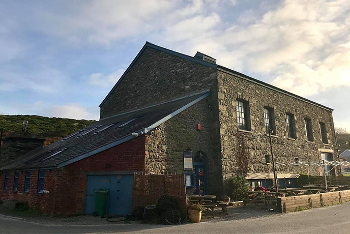 The traditional cottage exterior of The Shed Bistro in Porthgain