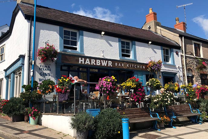 The pretty exterior of HARBWR in Saundersfoot