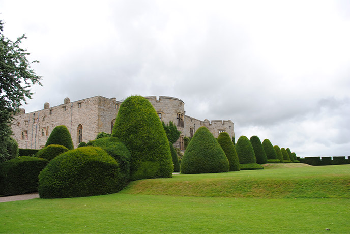 Chirk Castle in Wales surrounded by pristine lawns and manicured bushes
