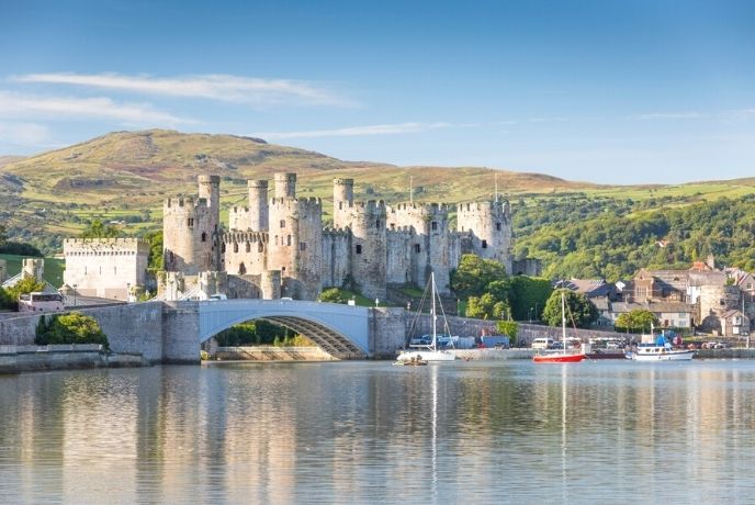 The iconic Conwy Castle with Snowdonia behind