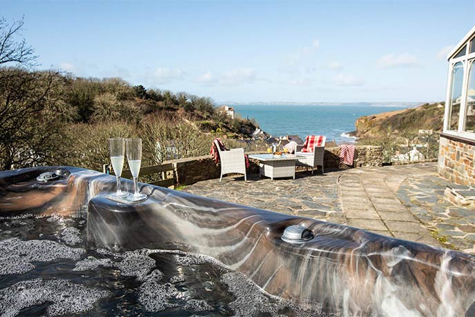 The stunning courtyard at Seaside House with ocean views and a hot tub