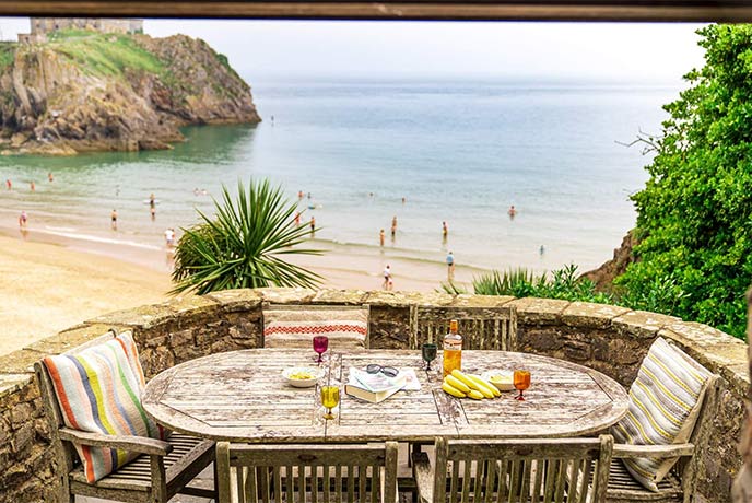 A table on the terrace of St Catherine's House looking out over the beach below