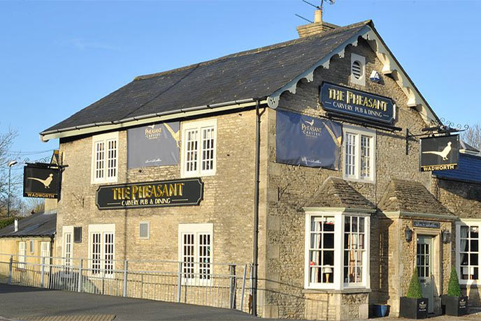 The Cotswold stone exterior of The Pheasant in Wiltshire