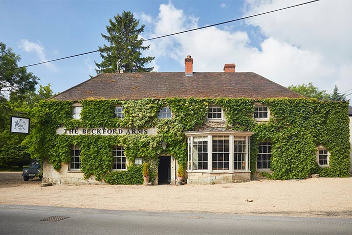 The ivy covered exterior of The Beckford Arms in Wiltshire