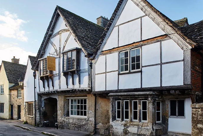 The Tudor exterior of the Sign of the Angel pub in Wiltshire