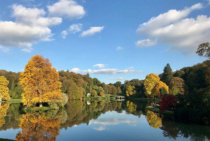 The lake at Stourhead surrounded with autumnal trees