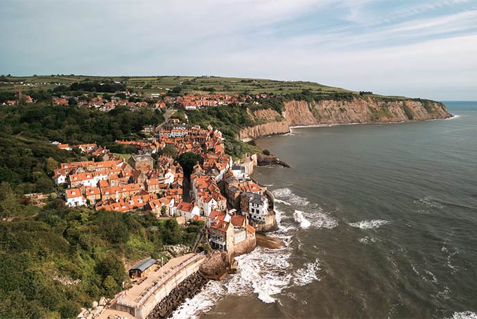 The beautiful village of Robin Hood's Bay in Yorkshire with red-roofs next to the sea