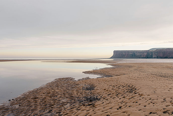 Golden sands and dramatic cliffs at Saltburn Beach in Yorkshire