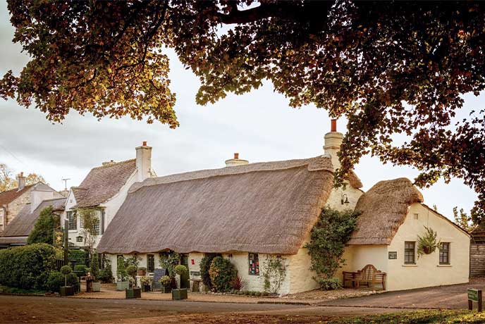 The traditional thatched exterior of Michelin-starred Star Inn in Yorkshire