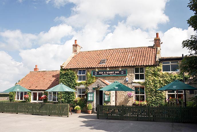 The pretty exterior of The Fox & Rabbit Inn in Yorkshire